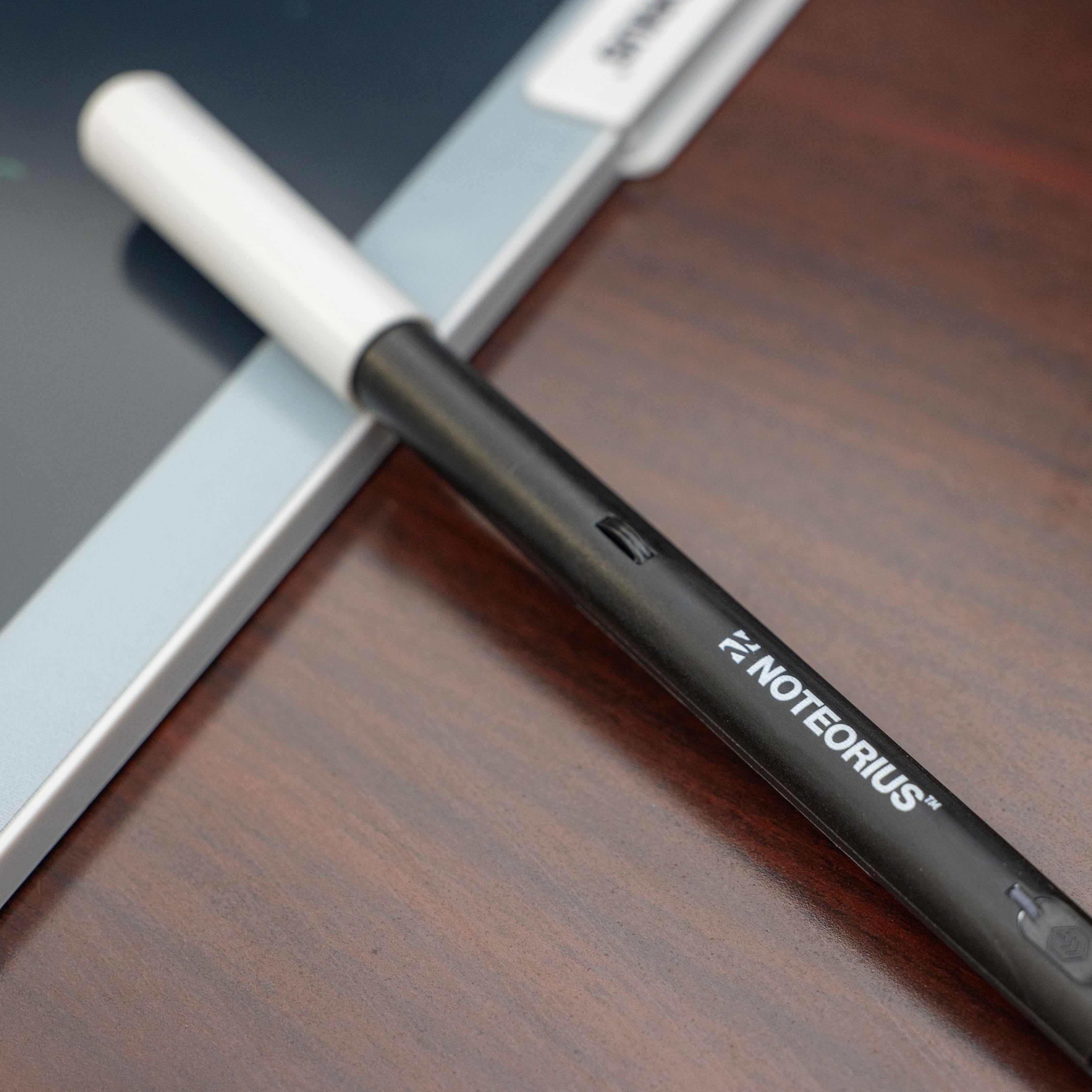 smart pen on digital notebook on desk